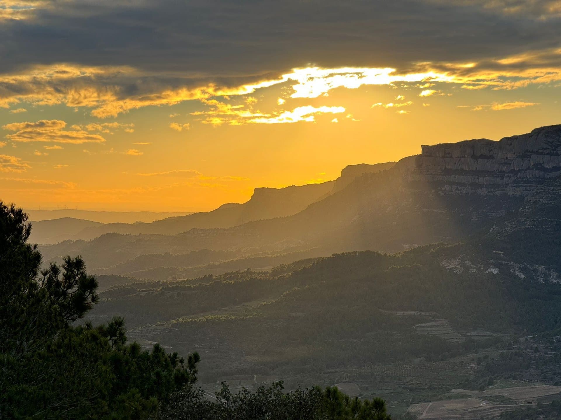 Sunset light over a mountain ridge